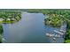 Aerial view of the community lake with homes and a marina nearby at 1215 Wynridge Xing, Alpharetta, GA 30005