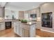 Kitchen with an island and stainless steel double oven at 1215 Wynridge Xing, Alpharetta, GA 30005