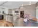 Kitchen with hardwood floors, island, and breakfast area with a table at 1215 Wynridge Xing, Alpharetta, GA 30005