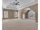 Spacious main bedroom featuring a tray ceiling, fan and lots of natural light from the large windows at 1215 Wynridge Xing, Alpharetta, GA 30005