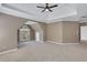 A spacious main bedroom featuring neutral walls, tray ceiling, and a large window for ample natural light at 1215 Wynridge Xing, Alpharetta, GA 30005
