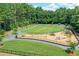 Overhead view of the community playground with swings and playset at 1215 Wynridge Xing, Alpharetta, GA 30005
