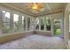 A charming sunroom with brick flooring, multiple windows, and natural lighting at 1215 Wynridge Xing, Alpharetta, GA 30005