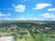 Expansive aerial view of the property, showcasing the surrounding landscape and lush greenery with a mountain in the background at 1236 Stone Mountain Lithonia Rd, Lithonia, GA 30058
