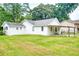 Spacious backyard with a large lawn at 1236 Stone Mountain Lithonia Rd, Lithonia, GA 30058