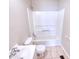 Bathroom features white vanity, tile flooring, and tub and shower surround at 1236 Stone Mountain Lithonia Rd, Lithonia, GA 30058