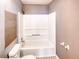 Cozy bathroom equipped with a standard bathtub-shower combo and a matching toilet at 1236 Stone Mountain Lithonia Rd, Lithonia, GA 30058