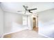 Neutral bedroom with a ceiling fan, window, and closet at 1236 Stone Mountain Lithonia Rd, Lithonia, GA 30058