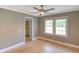 Bedroom illuminated by natural light and featuring a contemporary ceiling fan for added comfort at 1236 Stone Mountain Lithonia Rd, Lithonia, GA 30058