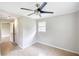 Neutral bedroom with a ceiling fan and two closets at 1236 Stone Mountain Lithonia Rd, Lithonia, GA 30058