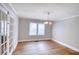 Dining room with hardwood floors, neutral walls, and a chandelier light fixture at 1236 Stone Mountain Lithonia Rd, Lithonia, GA 30058