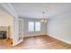 Dining room featuring hardwood floors, natural light from two windows, and a chandelier at 1236 Stone Mountain Lithonia Rd, Lithonia, GA 30058