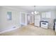 Spacious kitchen featuring white cabinets, and classic appliances at 1236 Stone Mountain Lithonia Rd, Lithonia, GA 30058