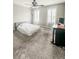 Bedroom featuring neutral walls, carpet floors, a ceiling fan, and two windows with plantation shutters at 1485 Oglethorpe Run Ln, Suwanee, GA 30024