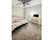 Cozy bedroom with carpet floors, neutral walls, a desk, and a bed at 1485 Oglethorpe Run Ln, Suwanee, GA 30024