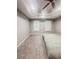 Spacious bedroom featuring neutral walls, carpet flooring, a tray ceiling, and plantation shutters at 1485 Oglethorpe Run Ln, Suwanee, GA 30024