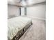 Spacious main bedroom with a tray ceiling, carpeted floor, and neutral decor; a serene retreat at 1485 Oglethorpe Run Ln, Suwanee, GA 30024