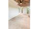 Covered patio with a ceiling fan at 1485 Oglethorpe Run Ln, Suwanee, GA 30024