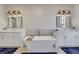 Elegant bathroom showcasing dual vanities, a freestanding tub, and modern lighting for a spa-like experience at 160 Cricket Ln, Alpharetta, GA 30009