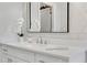 Modern bathroom features a white vanity, stylish mirror and neutral tones at 160 Cricket Ln, Alpharetta, GA 30009