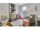 Adorable Bedroom with soft colors, a crib, cozy seating, and plenty of space for play at 160 Cricket Ln, Alpharetta, GA 30009