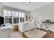 Bright bedroom with a large window, hardwood floors, and modern decor offers a cozy and stylish retreat at 160 Cricket Ln, Alpharetta, GA 30009