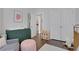 This charming Bedroom includes a changing table, soft rug, and ample storage, perfect for a young Gathering at 160 Cricket Ln, Alpharetta, GA 30009