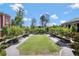 Well-manicured outdoor community green space with benches and trees at 160 Cricket Ln, Alpharetta, GA 30009