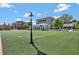 Expansive community green space with restaurant in the background at 160 Cricket Ln, Alpharetta, GA 30009