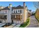 Beautiful townhomes with modern design, private porches, and well-manicured landscaping on a tree-lined street at 160 Cricket Ln, Alpharetta, GA 30009