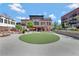 Commercial building exterior with outdoor seating and landscaping at 160 Cricket Ln, Alpharetta, GA 30009