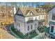 Elegant Smyrna home with brick accents, a balcony, and lush landscaping on a sunny day at 160 Cricket Ln, Alpharetta, GA 30009