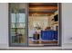 View of the bright, open-concept living room with modern furnishings and hardwood floors from the screened porch at 160 Cricket Ln, Alpharetta, GA 30009