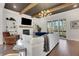 Stylish living room featuring wood floors, a white sofa, a fireplace, and sliding glass doors to a deck at 160 Cricket Ln, Alpharetta, GA 30009