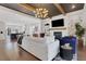Open-concept layout showcasing the living room with fireplace, hardwood floors, and view into the kitchen at 160 Cricket Ln, Alpharetta, GA 30009