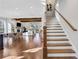 Bright and airy living room with a staircase, fireplace, wood floors, and an open floor plan at 160 Cricket Ln, Alpharetta, GA 30009