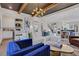 Bright and airy living area with an open floor plan to the dining area, wood floors, and stylish furnishings at 160 Cricket Ln, Alpharetta, GA 30009