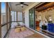 Enjoy the outdoors from this cozy screened porch with wood floors, string lights, and access to the living room at 160 Cricket Ln, Alpharetta, GA 30009