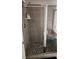 Modern tiled shower with glass doors and built-in seating area at 118 Reunion Pl, Acworth, GA 30102