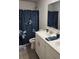 Well-lit bathroom with double sinks, modern fixtures, and a large shower at 118 Reunion Pl, Acworth, GA 30102