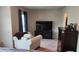 Spacious bedroom with TV, comfortable chair, and stylish dresser at 118 Reunion Pl, Acworth, GA 30102