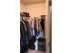 Organized walk-in closet with shelving, hanging rods, and secure storage at 118 Reunion Pl, Acworth, GA 30102