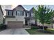 Charming two-story home with landscaped yard, two-car garage, and a welcoming front porch at 118 Reunion Pl, Acworth, GA 30102