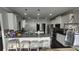 Well-appointed kitchen with ample counter space, stainless appliances, and breakfast bar seating at 118 Reunion Pl, Acworth, GA 30102