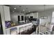 Bright kitchen boasts granite countertops, stainless appliances, and an adjacent dining area at 118 Reunion Pl, Acworth, GA 30102