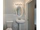 Cozy bathroom with white tile and pedestal sink at 2465 Hogan Rd, Atlanta, GA 30344