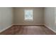 Neutral bedroom featuring a window with blinds, providing a bright and airy atmosphere at 2465 Hogan Rd, Atlanta, GA 30344