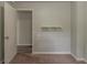 Bedroom with neutral walls, white door and a shelf on the wall at 2465 Hogan Rd, Atlanta, GA 30344