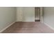 Bedroom with neutral walls, and view into hallway with wood floors at 2465 Hogan Rd, Atlanta, GA 30344