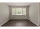 Neutral bedroom space featuring a window that provides natural light at 2465 Hogan Rd, Atlanta, GA 30344
